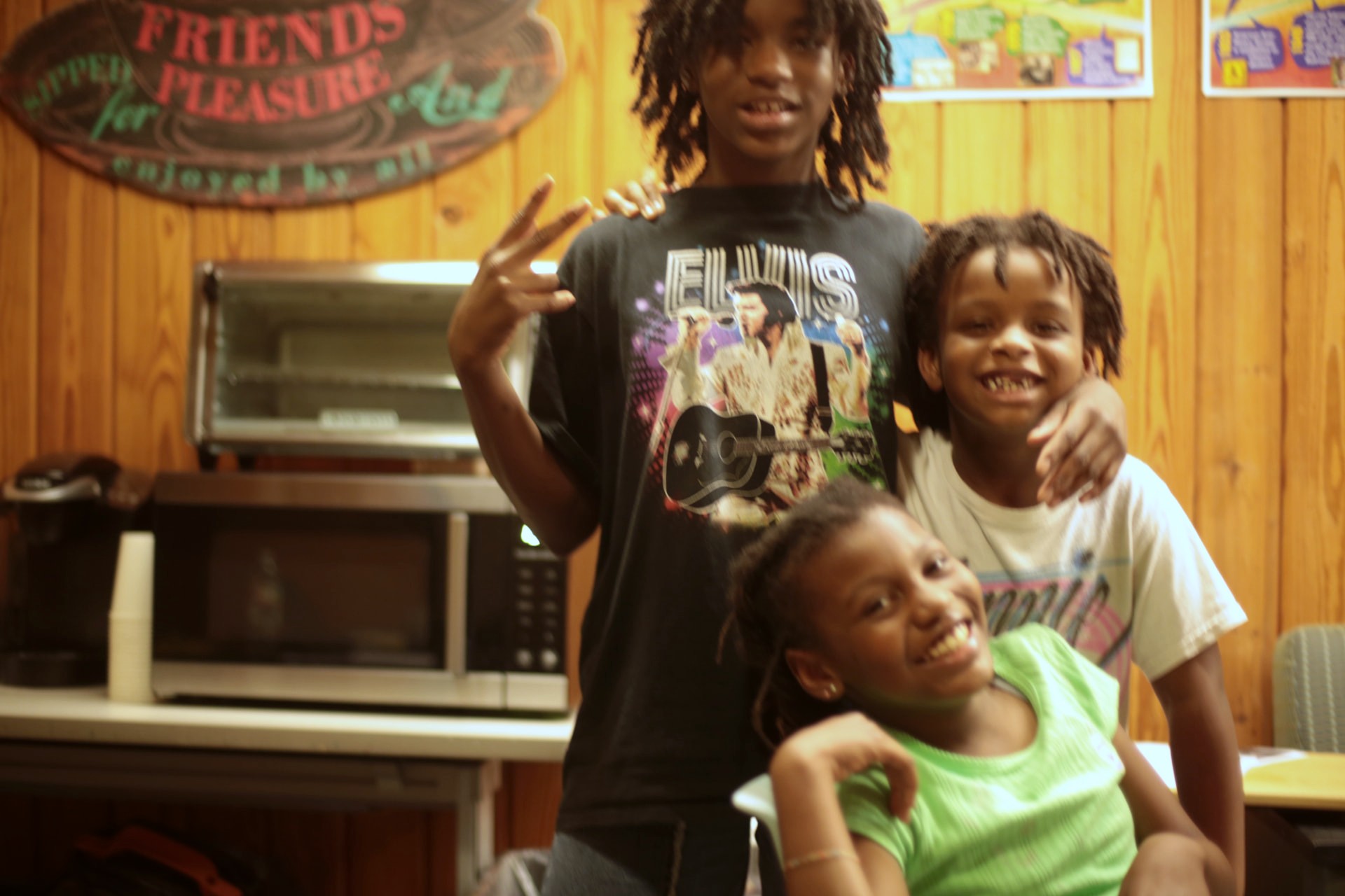 Young people posing together at a HALO community session in Little Rock