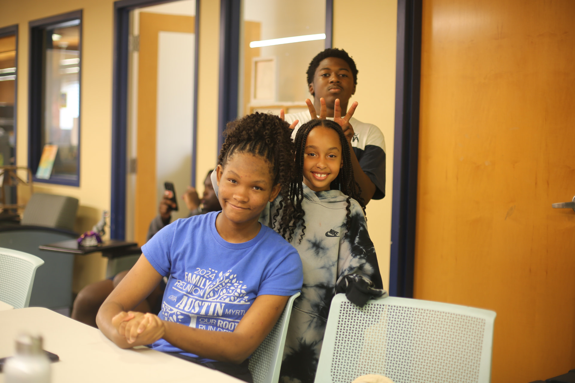Two cohort participants smiling together at a table