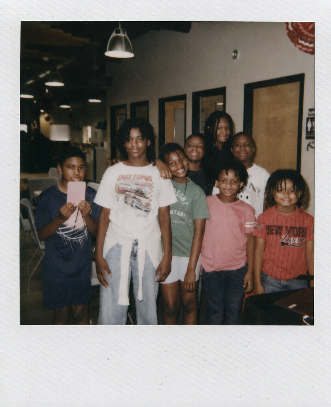 Polaroid group photo of the first HALO cohort